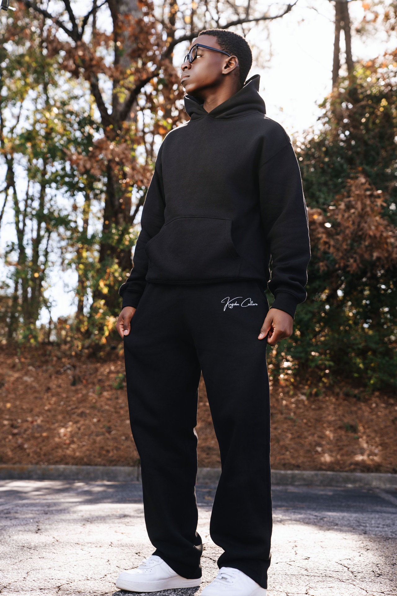 Kngdm Culture Sweatpants worn outdoors